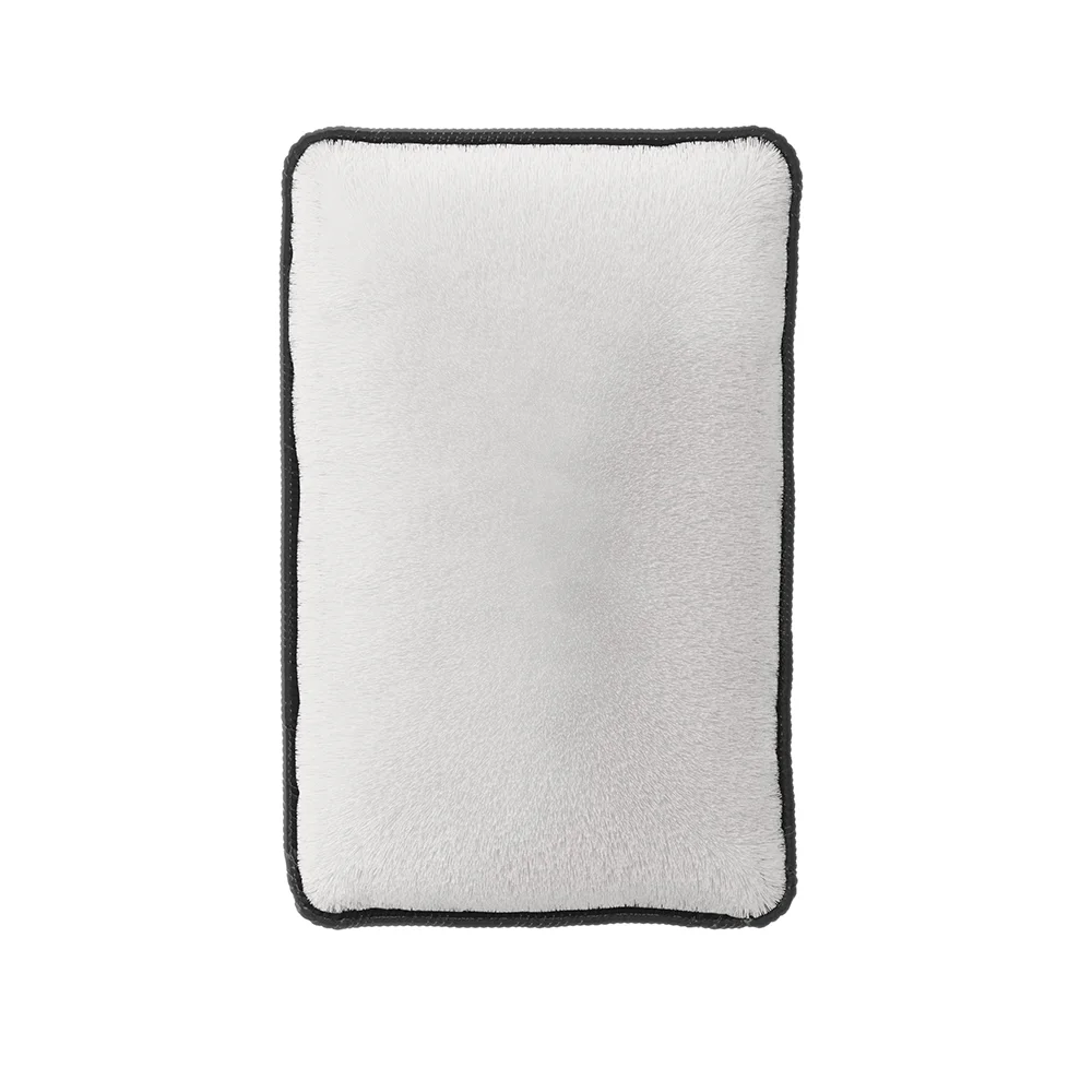 ADBL_Scrub_Bar A gray foam pad with silver trimmings against a white background.