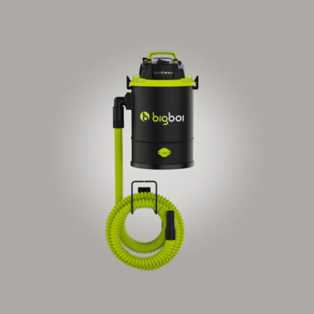 A black and lime-green mini car vacuum cleaner against a gray background.