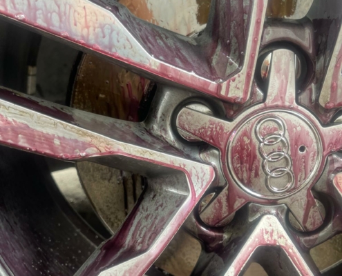An alloy rim with exposed contaminants (iron fallout).